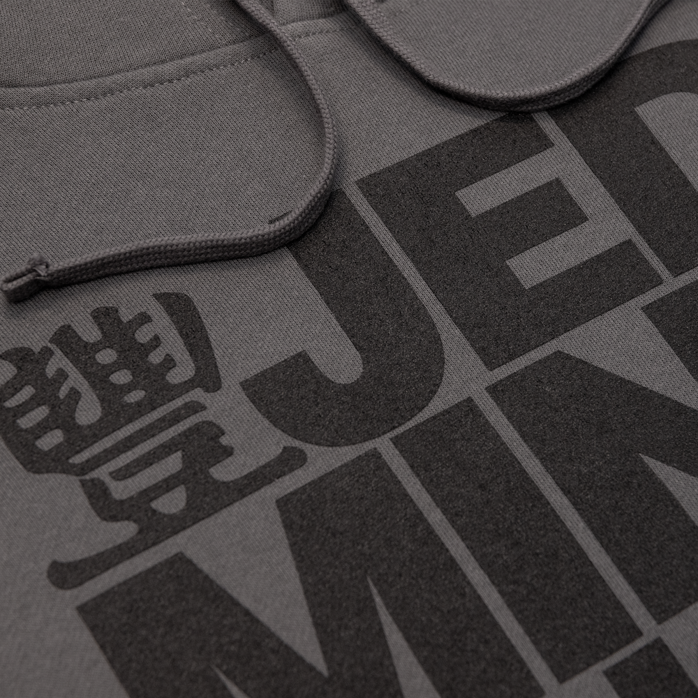 Close up photo of JMT Stacked Logo Hoodie Black on Charcoal