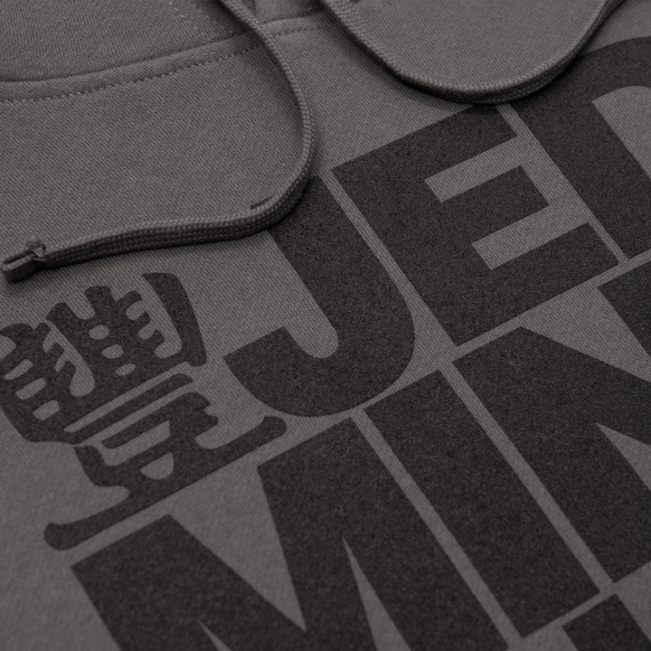 Close up photo of JMT Stacked Logo Hoodie Black on Charcoal
